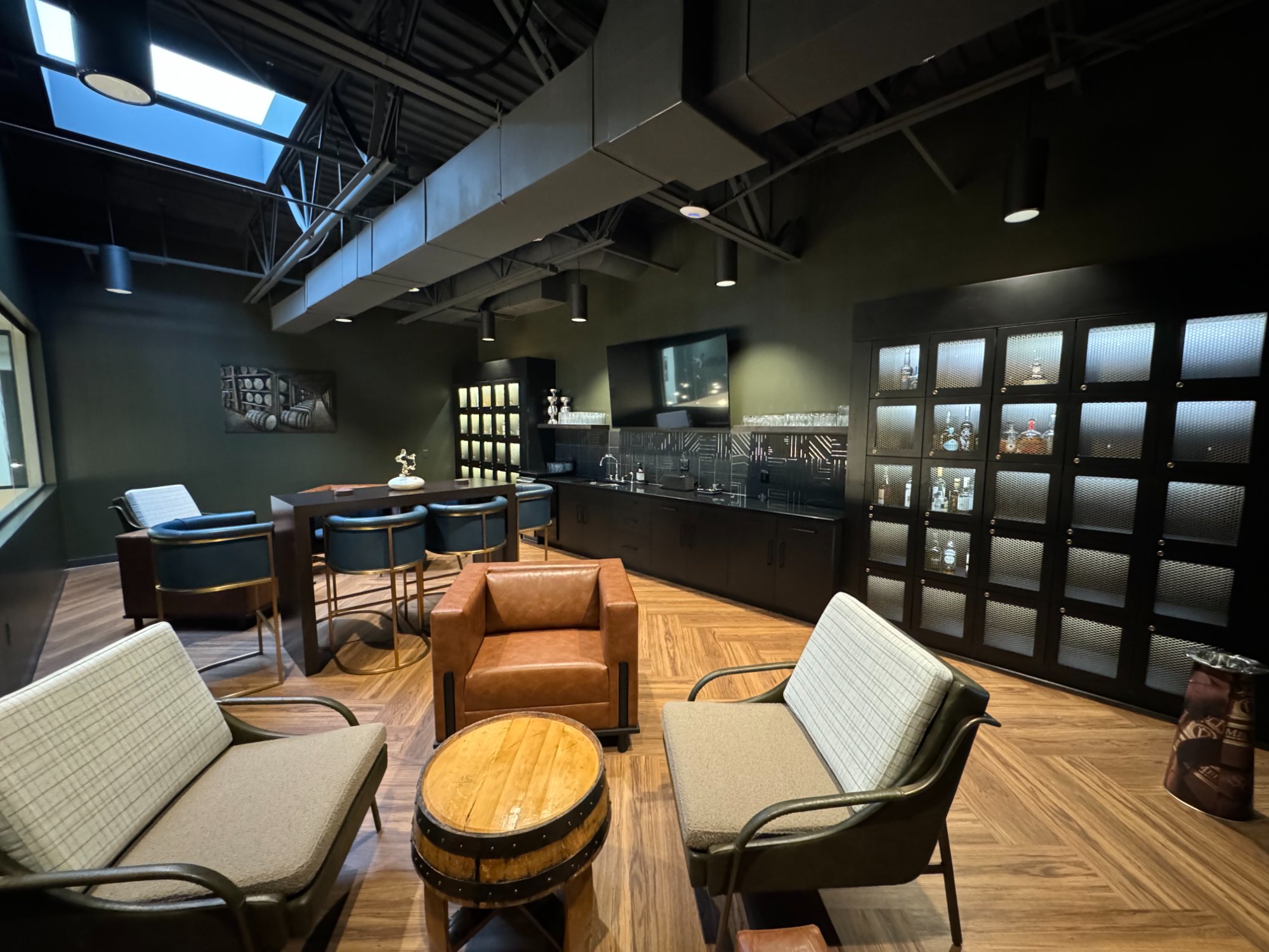 The C-Suite executive lounge with bourbon lockers and luxury seating
