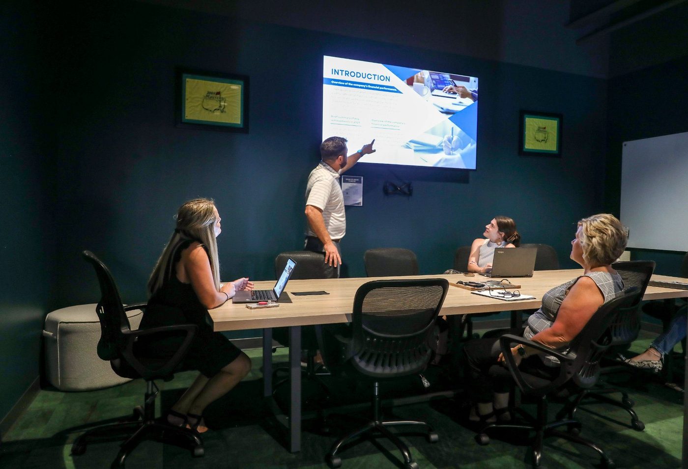 Small team meeting with TV presentation in Emergency 9 at Revelance, Mason Ohio