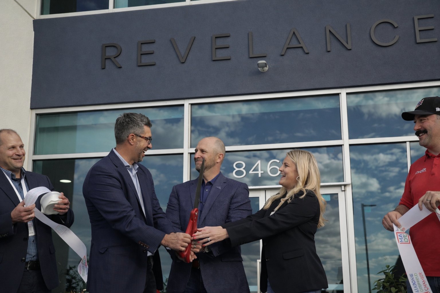 Ribbon cutting moment at the Revelance grand opening, November 2024