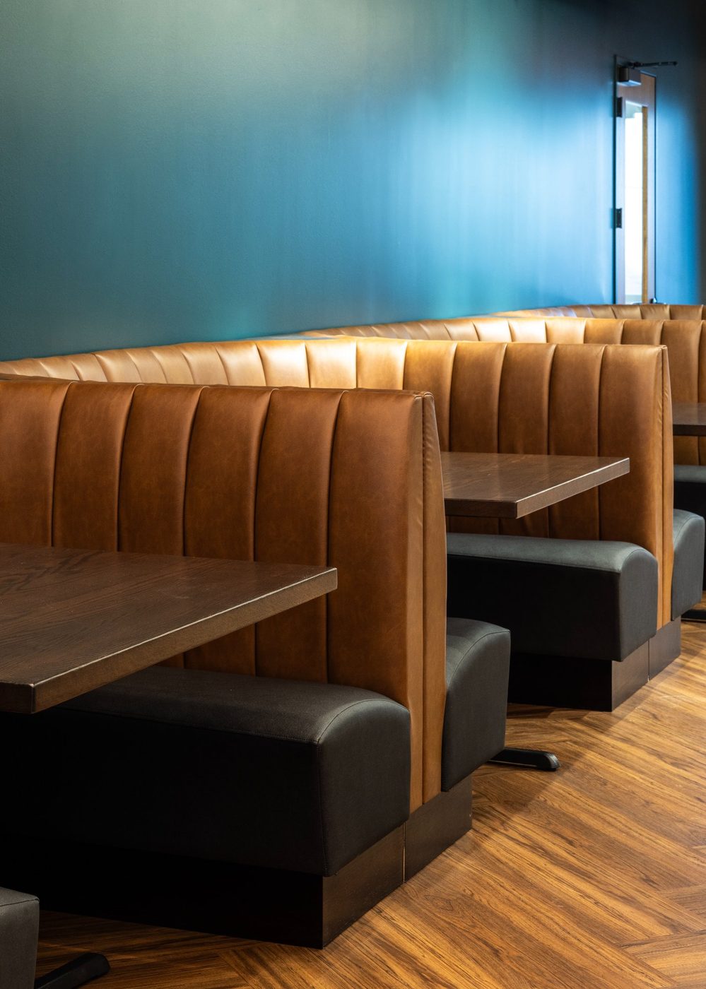 Leather banquette seating at The Taproom Revelance